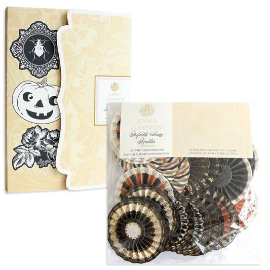 Two packs of Perfectly Scary Halloween Embellishments with vintage Halloween designs and assorted black, orange, and gold rosettes—ideal for spooky crafts.