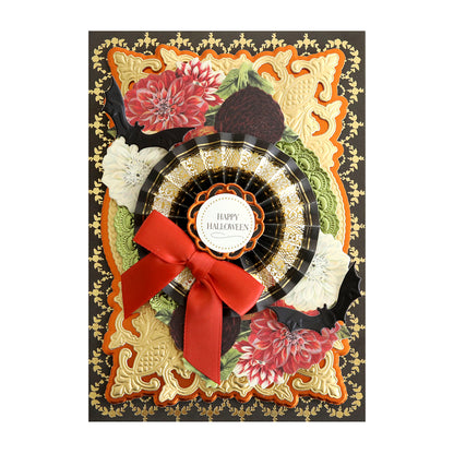 The Perfectly Scary Halloween Embellishments feature gold designs, flowers, scary rosettes, black bats, a red bow, and a round “Happy Halloween” label.