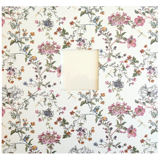 A square white frame with an intricate floral pattern featuring various flowers and leaves, reminiscent of memories captured in a Wildflower Meadow Scrapbook Album, surrounds a small blank square in the center.