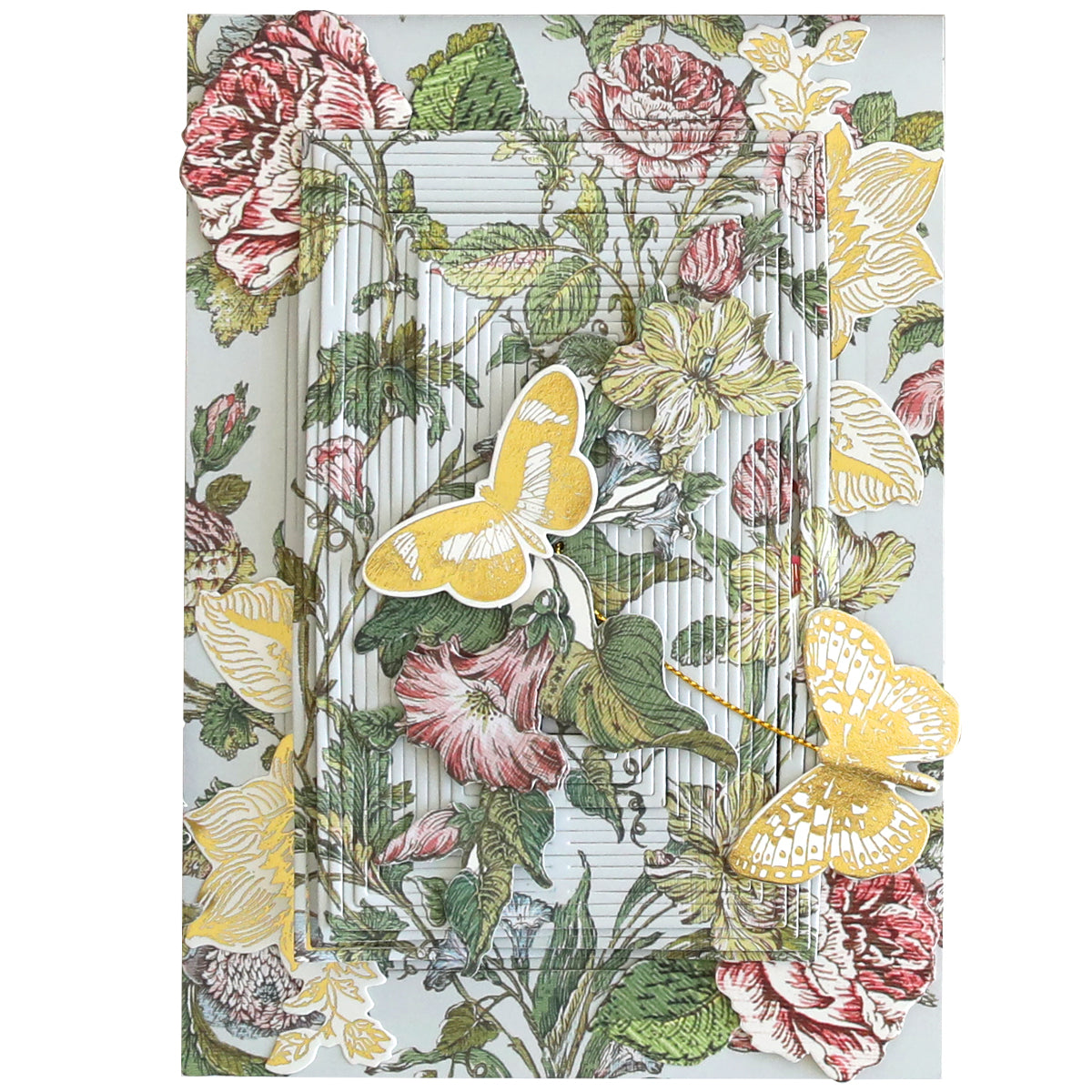 A decorative greeting card with a floral background featuring pink and yellow flowers and two yellow butterflies. The card, reminiscent of a Wildflower Meadow Papercrafting Kit, has an intricate, layered design creating a 3D effect.