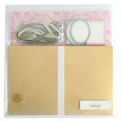 The Crop at Home 4 Swag includes a clear plastic envelope with gold paper, green ribbon, round and square labels, and a "Swag" card—ideal scrapbooking supplies for any creative project.