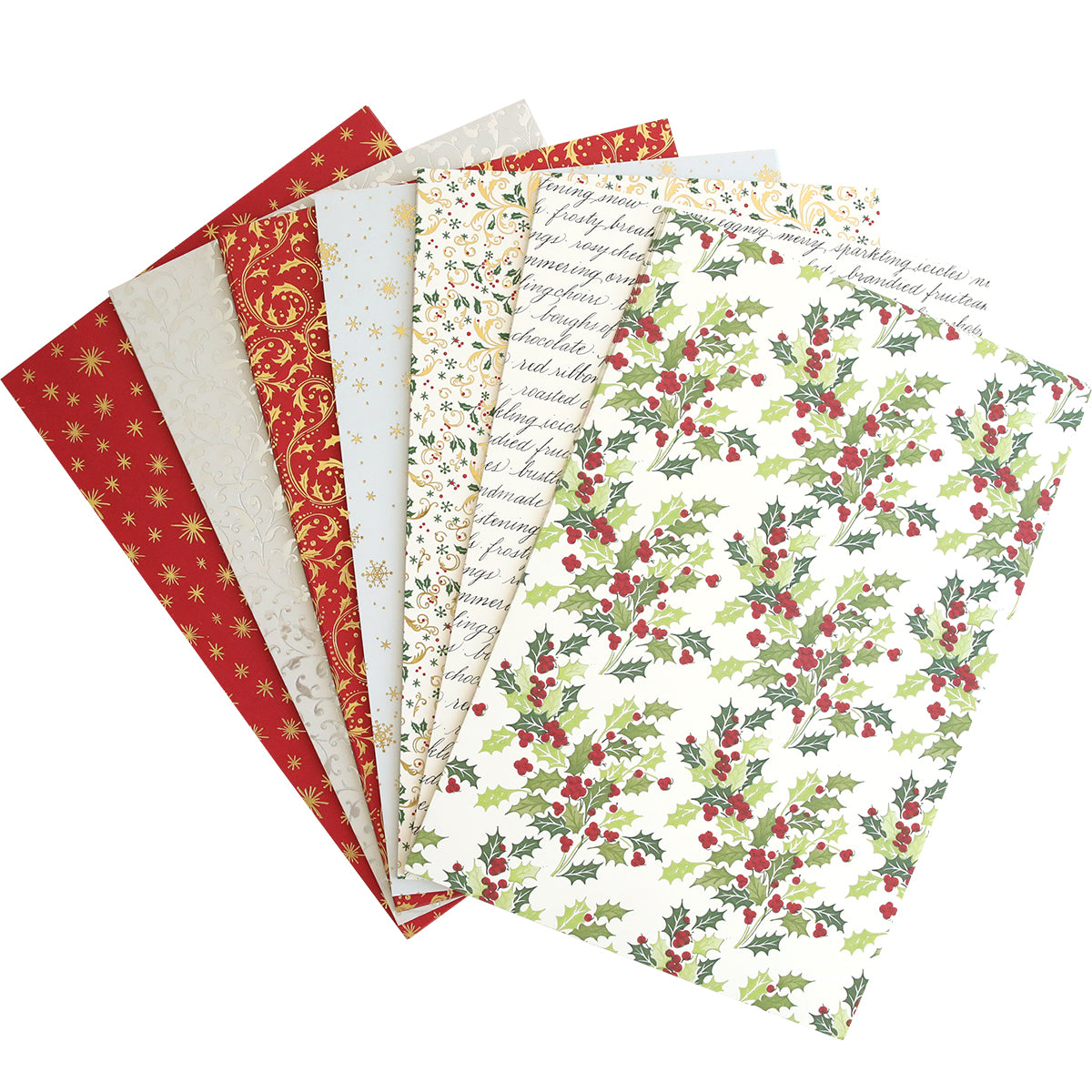 A variety of Christmas Double Sided 300gsm Cardstock are spread out in a fan arrangement. Patterns include stars, holly leaves, script text, and ornate designs in red, green, gold, and cream colors.