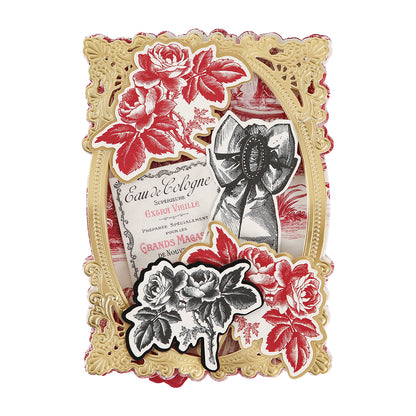 Ornate vintage-style frame with red roses, a black-and-white bouquet, and a “Eau de Cologne” bottle label adorned with decorative script and a black ribbon—perfect for crafting elegant perfume box dies from Toile Doublesided 300gsm Cardstock.