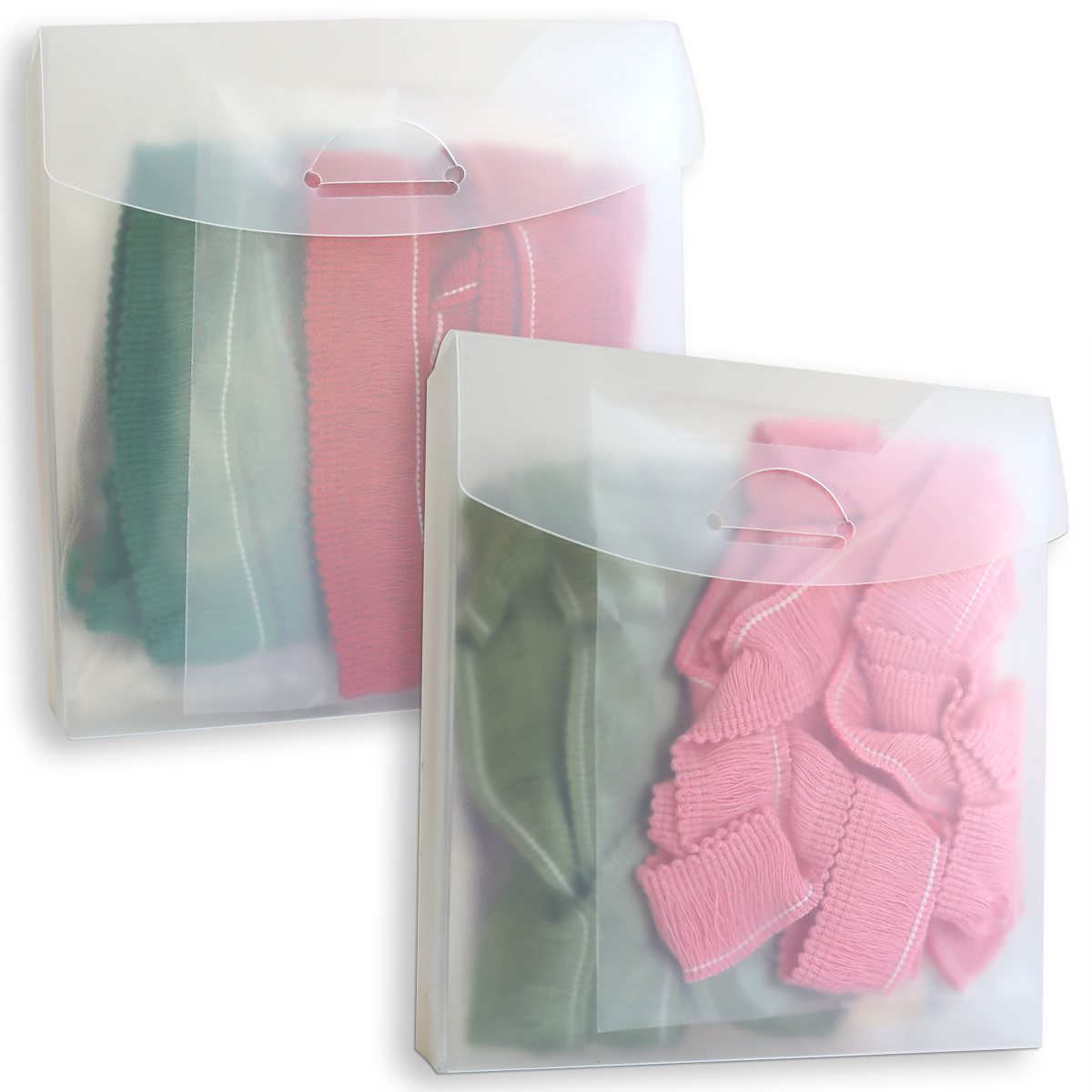 Two translucent plastic envelopes containing Perfect Palette Fringe for Every Season, each with folded lengths of green and pink Christmas fringe trim.