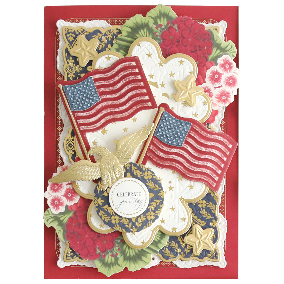 Patriotic-themed greeting card featuring American flags, gold stars, foil embellishments, and floral decorations with a "Celebrate Your Day" message in the center. Perfect for those who love star-studded cards and have a keen eye for Celebration Chest Craft Box Refill supplies.