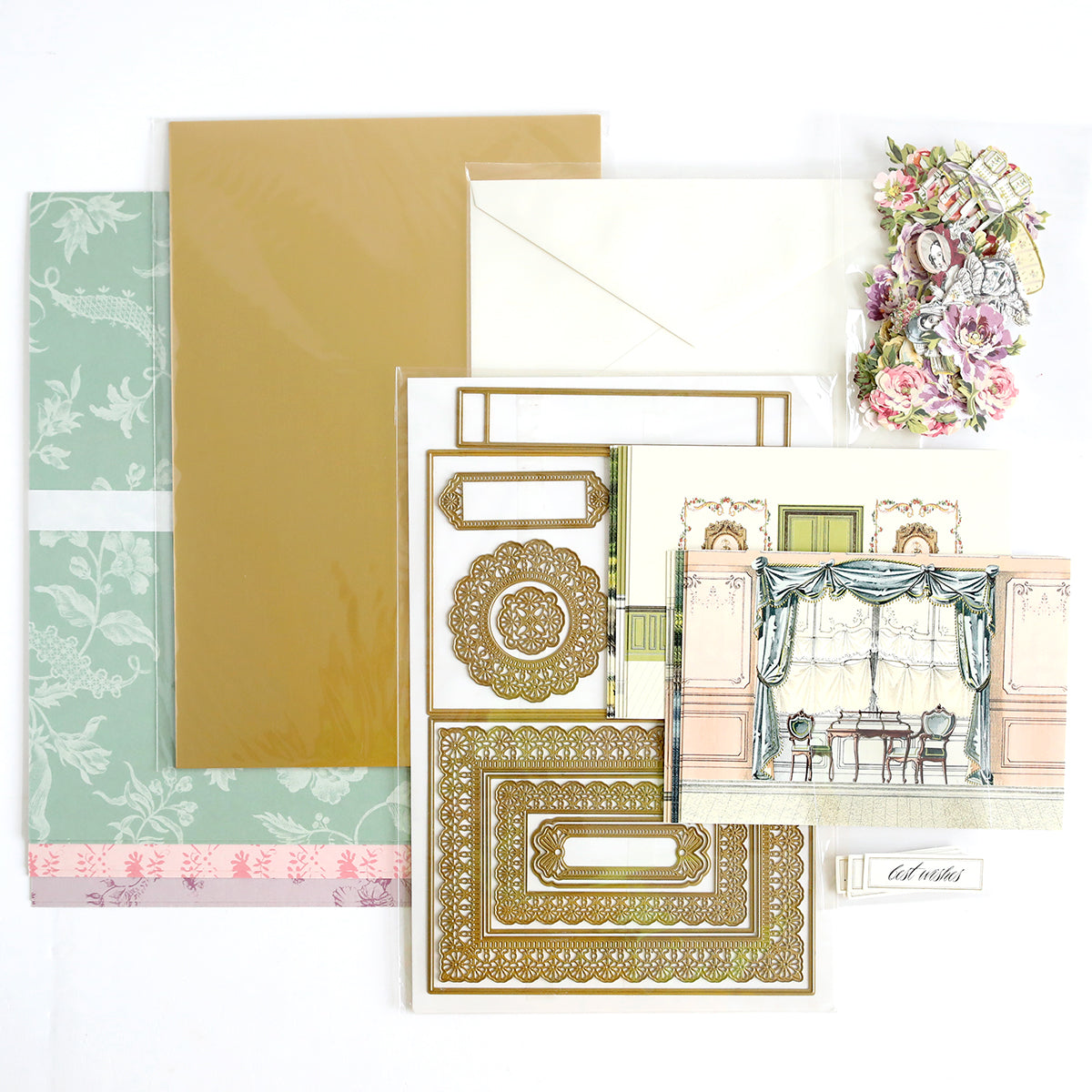 Theatrical Greetings Encore Set cardmaking kit with patterned paper, luxury matte foil cardstock, an envelope, ornate Theatrical Greetings Dies, an illustrated card front, floral accents, and a label.