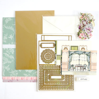Theatrical Greetings Encore Set cardmaking kit with patterned paper, luxury matte foil cardstock, an envelope, ornate Theatrical Greetings Dies, an illustrated card front, floral accents, and a label.