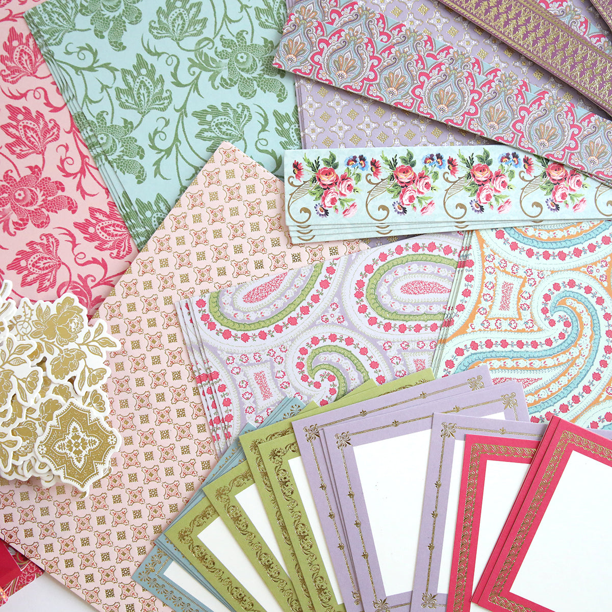 Enhance your Simply Paisley Mini Album with a selection of decorative paper sheets featuring floral embellishments and geometric patterns in elegant pink, green, and gold tones for the perfect addition to your scrapbook kit.