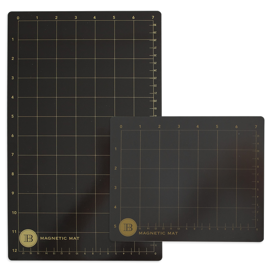 A set of two Empress Magnet Mats, featuring grid lines and measurement scales in black, is ideal for die-cutting projects; the larger mat pairs with its smaller counterpart to enhance your Empress Machine setup seamlessly.