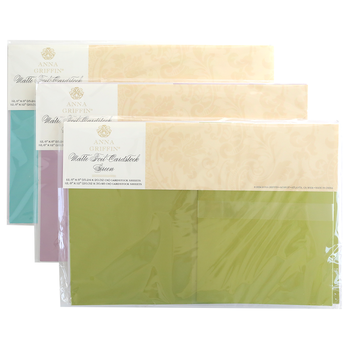 A Set of 3 Luxury Matte Foil Cardstock in lavender, blue, and green—ideal for embossing or die-cutting—is neatly stacked and sealed in clear plastic packaging.