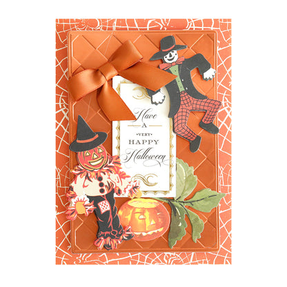 Handcrafted Halloween card, titled “Haunted Halloween Haul,” features an orange bow, a spiderweb background, a pumpkin, fall leaves, and two scarecrow figures—including one in a witch hat—all made with premium Halloween craft supplies. Festive glitter cardstock adds extra sparkle, while cheerful Halloween stickers finish the design. Center text reads: “Have a very Happy Halloween.”.