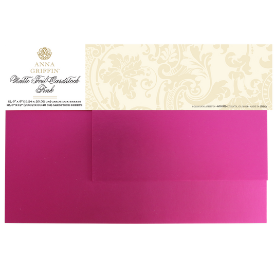 A pack of Luxury Matte Foil Cardstock Pink, ideal for embossing or die-cutting, contains two glossy pink sheets beneath a decorative label.