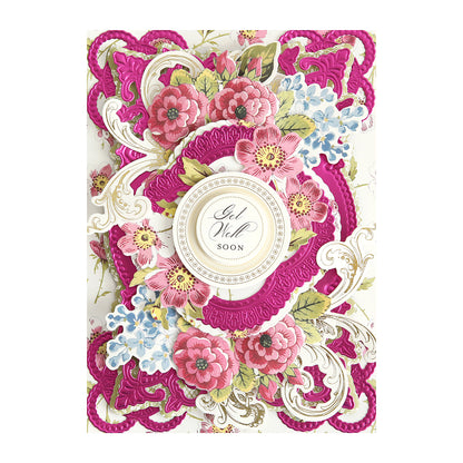 A decorative "Get Well Soon" card made with Luxury Matte Foil Cardstock in Bright Pink, featuring ornate floral designs, intricate diecutting, and layered embellishments for an elegant touch.