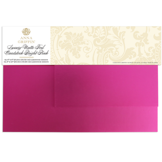 The Luxury Matte Foil Cardstock Bright Pink includes two sheets with a decorative label—ideal for diecutting and bringing elegant style to your craft projects.