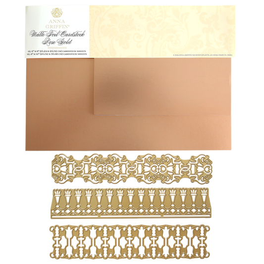 12″ Regal Trimmings Border Dies in ornate gold designs are shown alongside rose gold matte foil cardstock sheets, all displayed on a white background with the product packaging at the top.