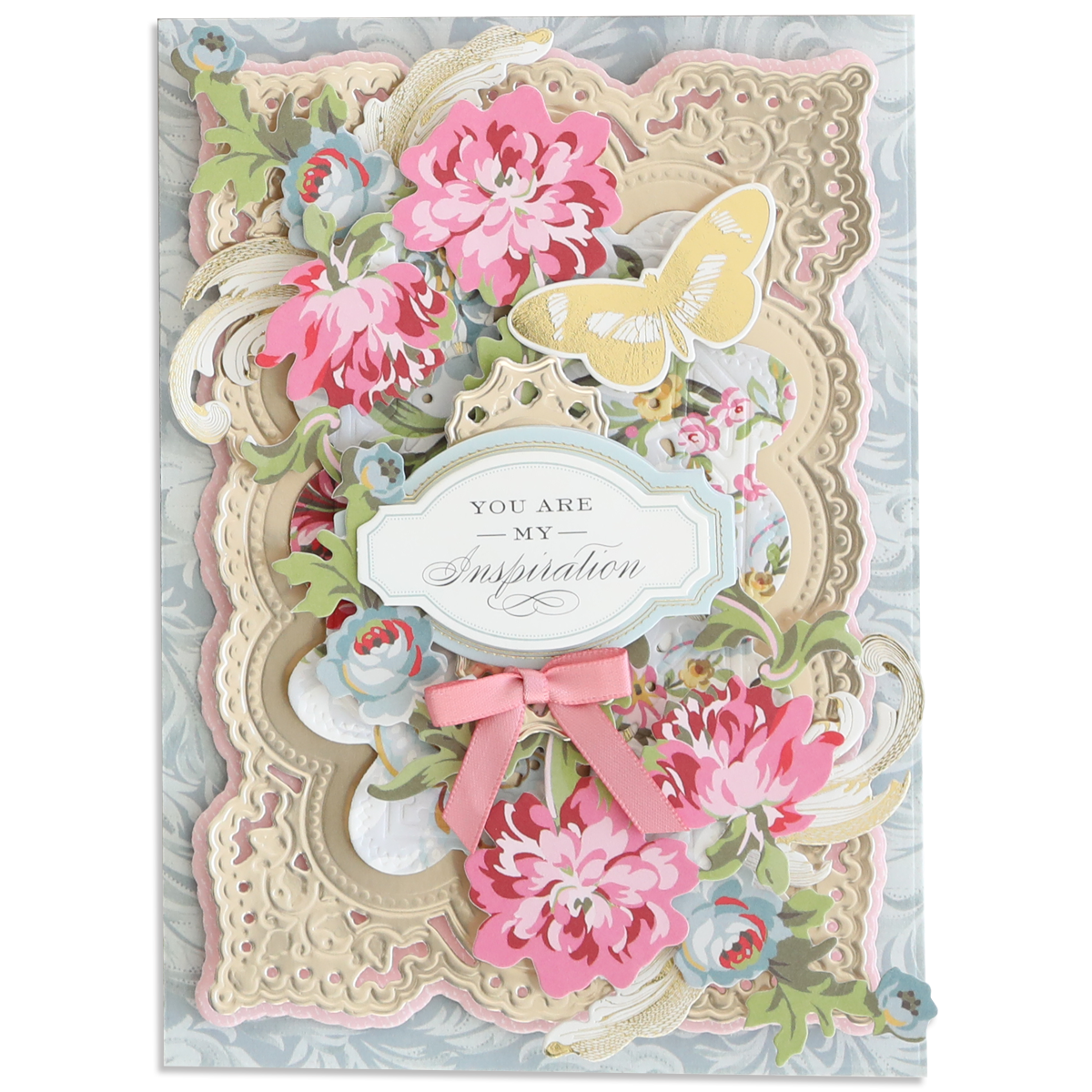 A decorative greeting card with layered floral designs, a yellow butterfly, a pink bow, and a "You are my inspiration" label on an ornate background crafted from Luxury Matte Foil Cardstock Champagne and Black.