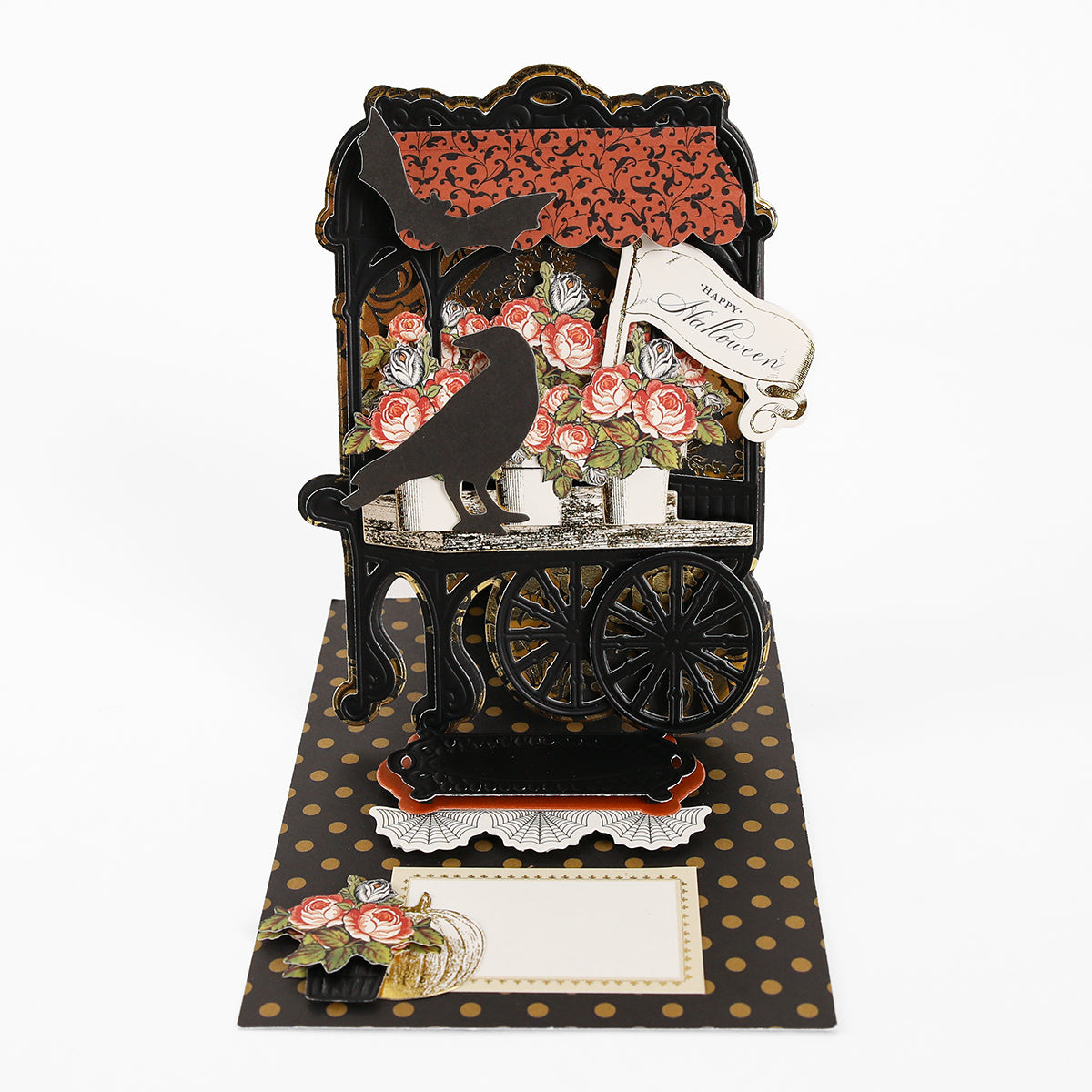Halloween-themed pop-up card crafted from Luxury Matte Foil Cardstock Black, featuring a black cart, roses, two crows, a “Happy Halloween” tag, and a gold polka dot background—perfect for diecutting enthusiasts.