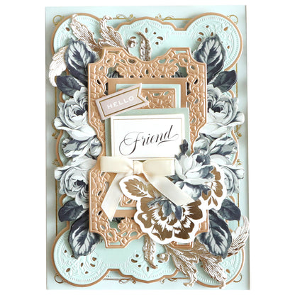 A handcrafted greeting card featuring ornate filigree, layered frames, and floral decorations with a central label reading "Friend" and a smaller "HELLO" tag. Adorned with stickers from the Black and Cream Flower Stickers collection, this card makes the perfect embellishment for scrapbook pages too.