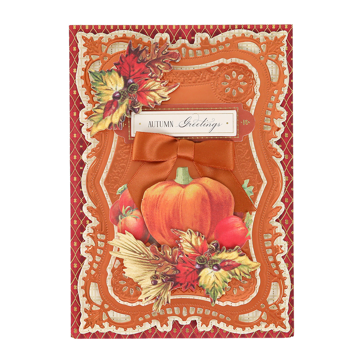 Here is a rewritten sentence using the product data: A greeting card featuring a pumpkin, leaves, and fruit motif adorned with Harvest Embellishment Stickers, dimensional accents, an orange bow, ornate borders, and a rectangular label at the top center displaying the text “Autumn Greetings.”.