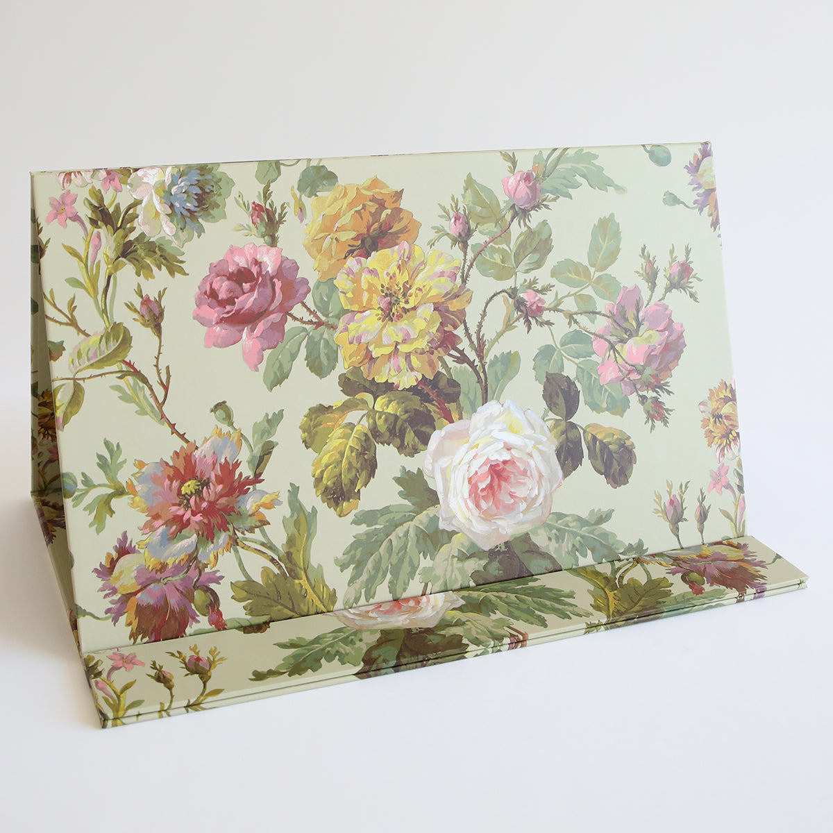 The Magnetic Die Stand Francesca features a floral pattern with large roses and leaves on a light background, making it perfect for adding charm to your craft room.