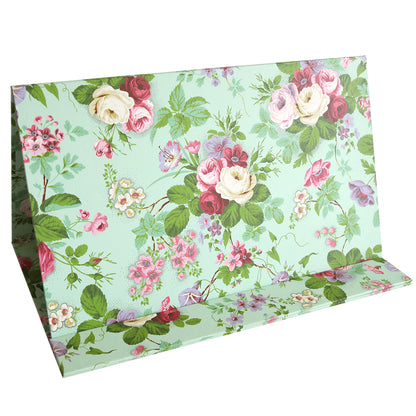 The Magnetic Die Stand Amelie, a green cardboard display stand adorned with various colorful floral patterns including roses and leaves, is perfect for organization and crafting.