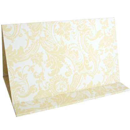 The "Magnetic Die Stand Ivory Damask" features a folded card with a light yellow and white damask pattern, perfect for adding a touch of elegance to your craft room while keeping your dies organized and on hand.