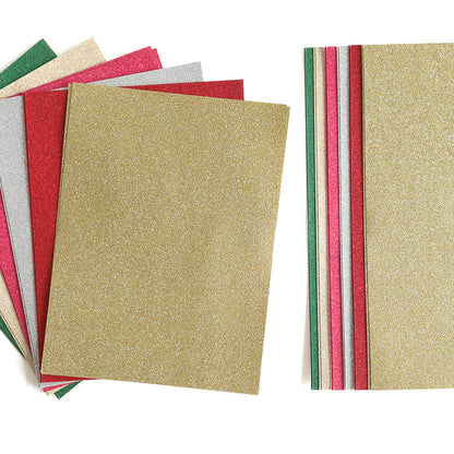 A collection of Luxury Glitter Cardstock sheets, showcasing an array of vibrant shades including gold, silver, red, green, and pink, arranged in a partially fanned-out and stacked display.