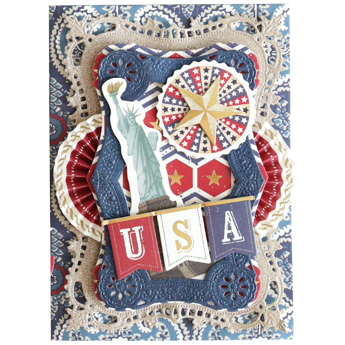 A decorative card made with Luxury Glitter Cardstock featuring the Statue of Liberty, a star, patriotic patterns, and a "USA" banner on a blue and red background for an elegant, eye-catching look.