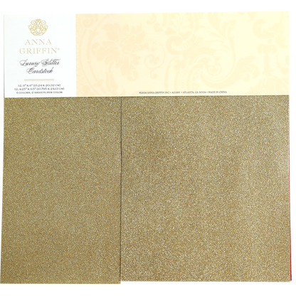 A package of Luxury Glitter Cardstock by Anna Griffin, featuring 12 sheets of gold glitter paper.