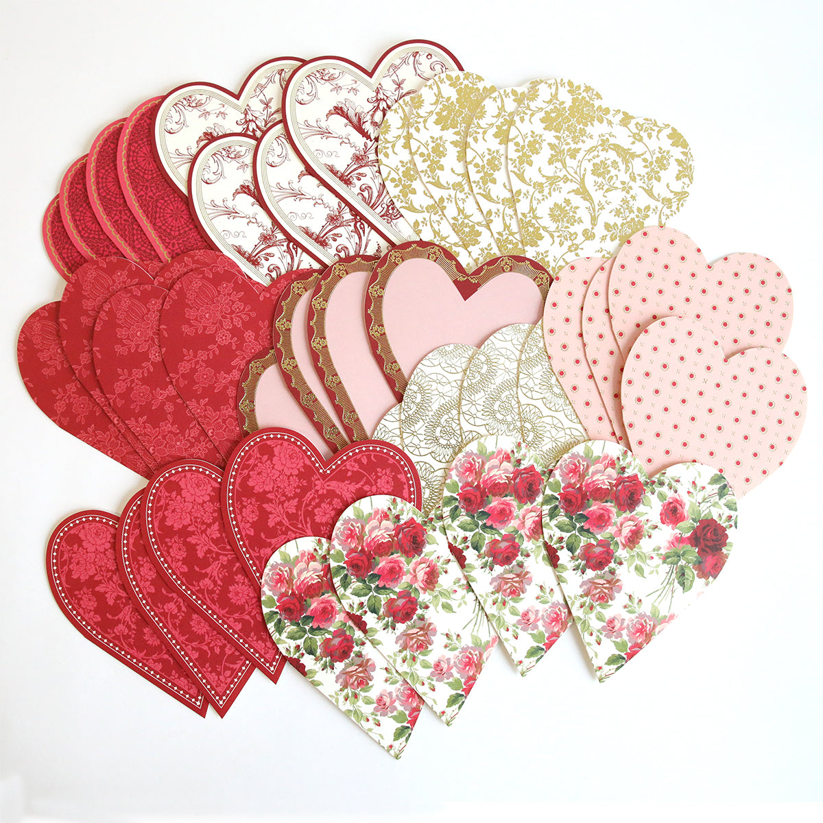 The Heart Shaped Cards with Envelopes 36 count features a range of heart-shaped cards in red, pink, and gold adorned with floral and polka dot designs, laid out on a white background—ideal for tucking into vellum envelopes.