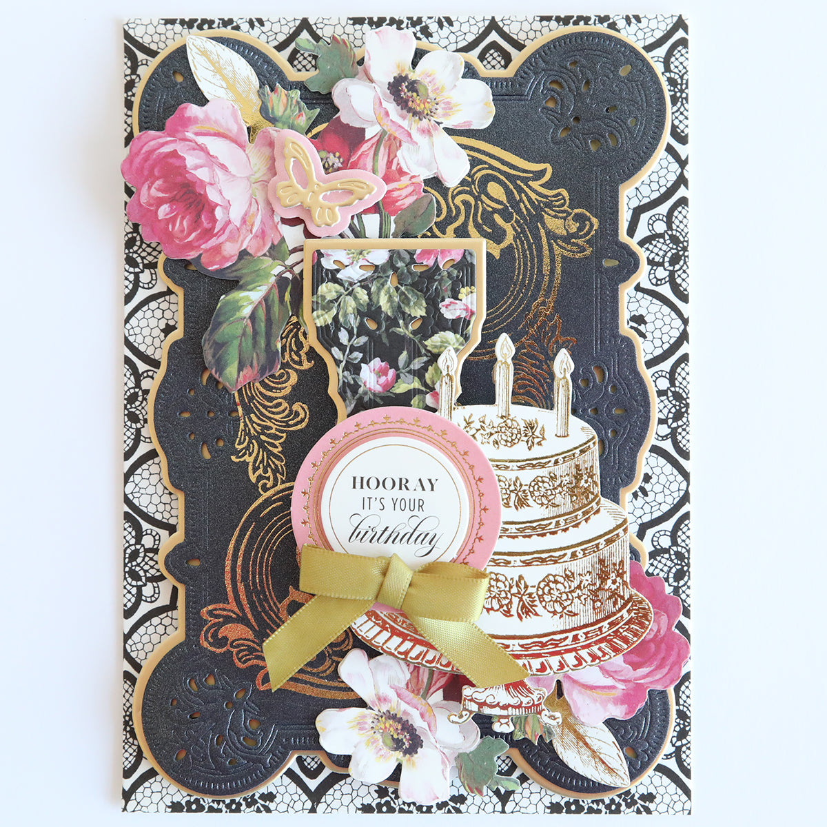 The "Glorious Foil Rub Ons Gold" features a floral design with gold foil in a cake illustration with candles and the message "Hooray, It's Your Birthday." Ideal for craft projects or adding elegance to celebrations.