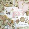 A flat lay featuring Crop at Home 5 Printed Instructions, floral-patterned double-sided pages, scissors, glue, and step-by-step guides, all arranged on a coordinating floral background.