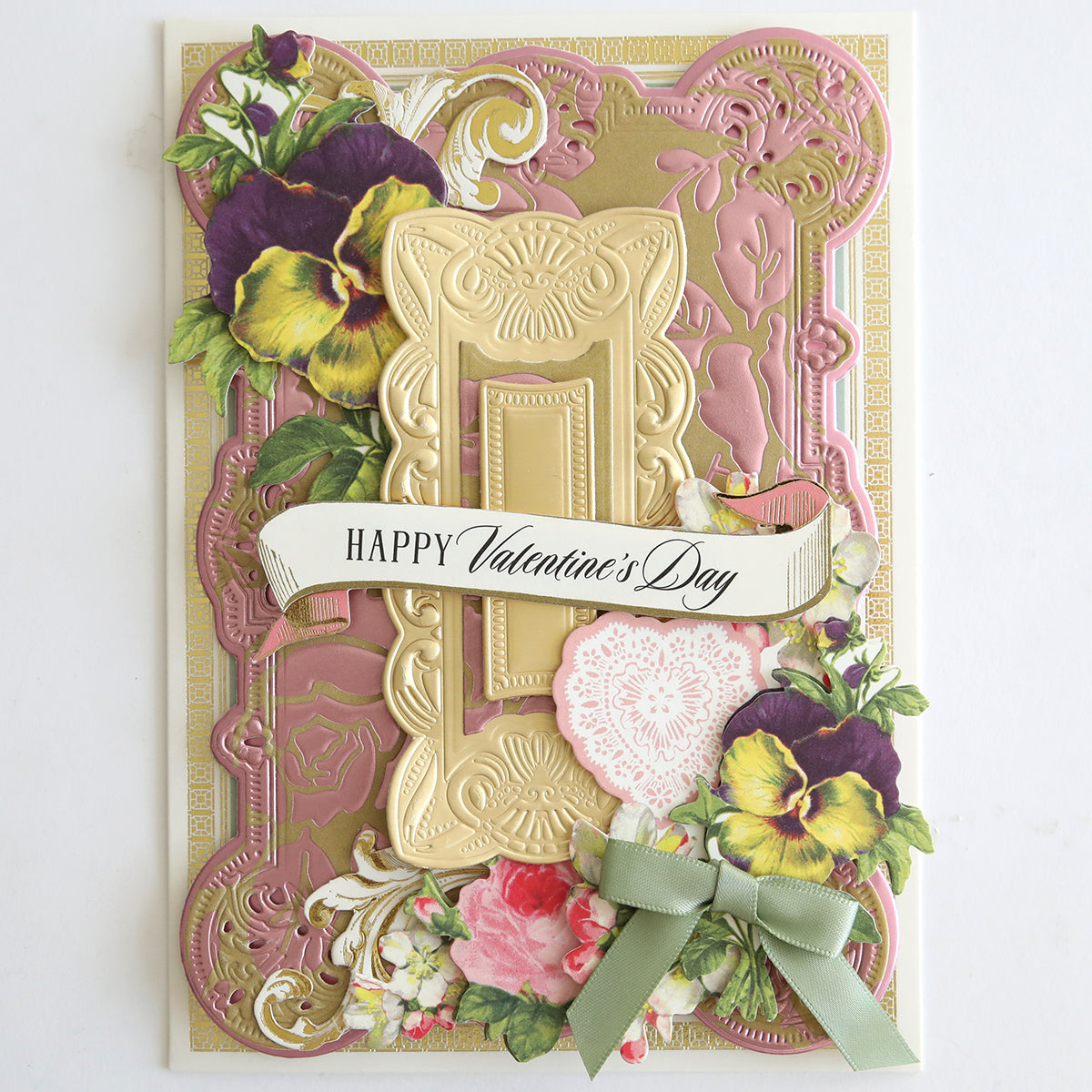 A decorative Valentine’s Day card featuring gold and pink embossed roses, floral details, a green bow, and a “Happy Valentine’s Day” banner, crafted from Luxury Tonal Foil Heartfelt Cardstock for an elegant finish.