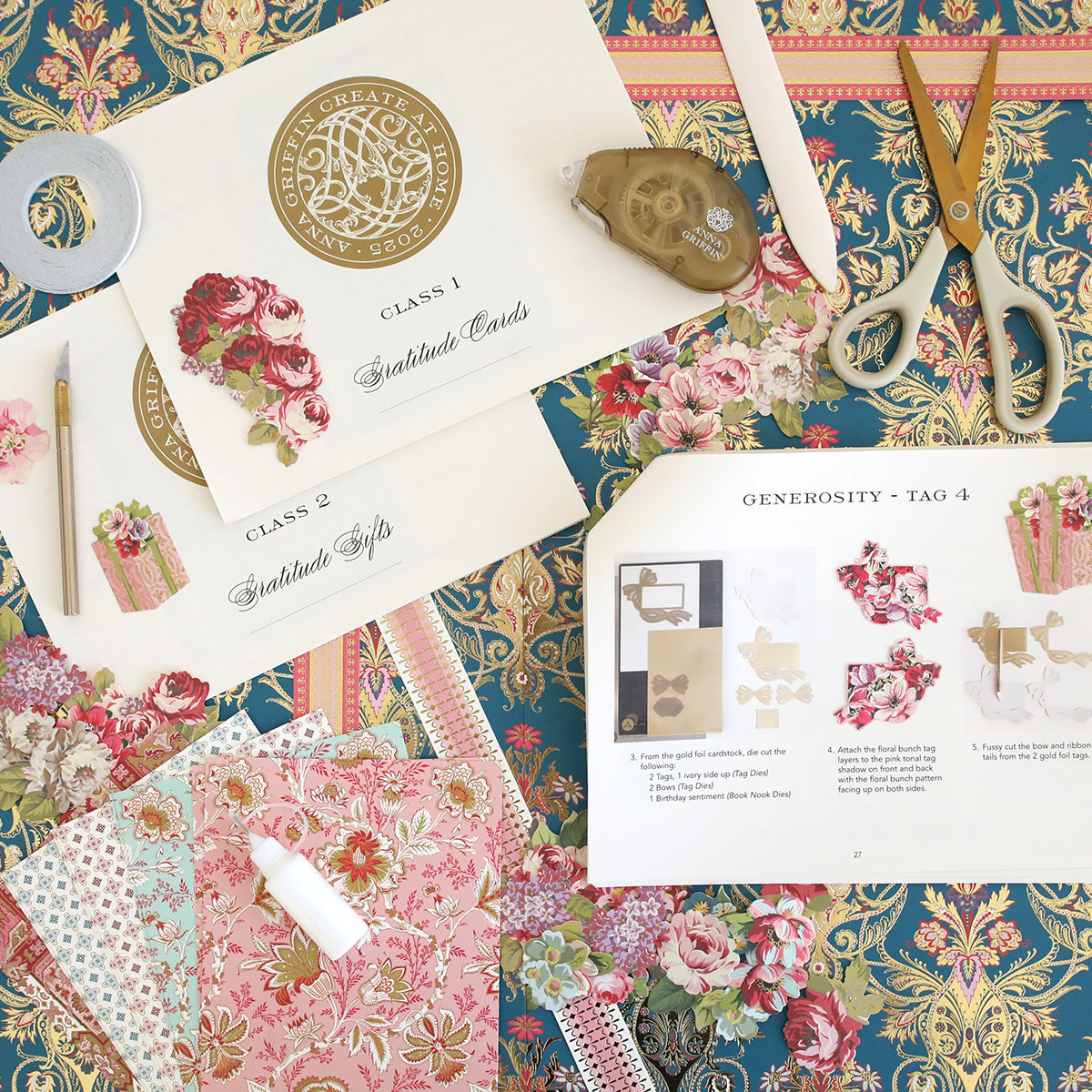 A flat lay of decorative paper, scissors, ribbon, glue, and Create 2025 Instructions with color photos and step-by-step guides on a floral patterned background—perfect for Fall 2025 projects.