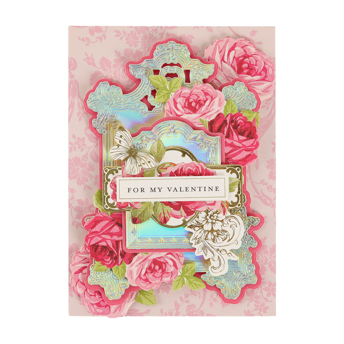 A Valentine’s Day card crafted with Luxury Iridescent Foil Cardstock features pink roses, a white butterfly, gold accents, and a “For My Valentine” sign against a pastel pink floral background—adding an elegant, shimmering touch to your heartfelt message.