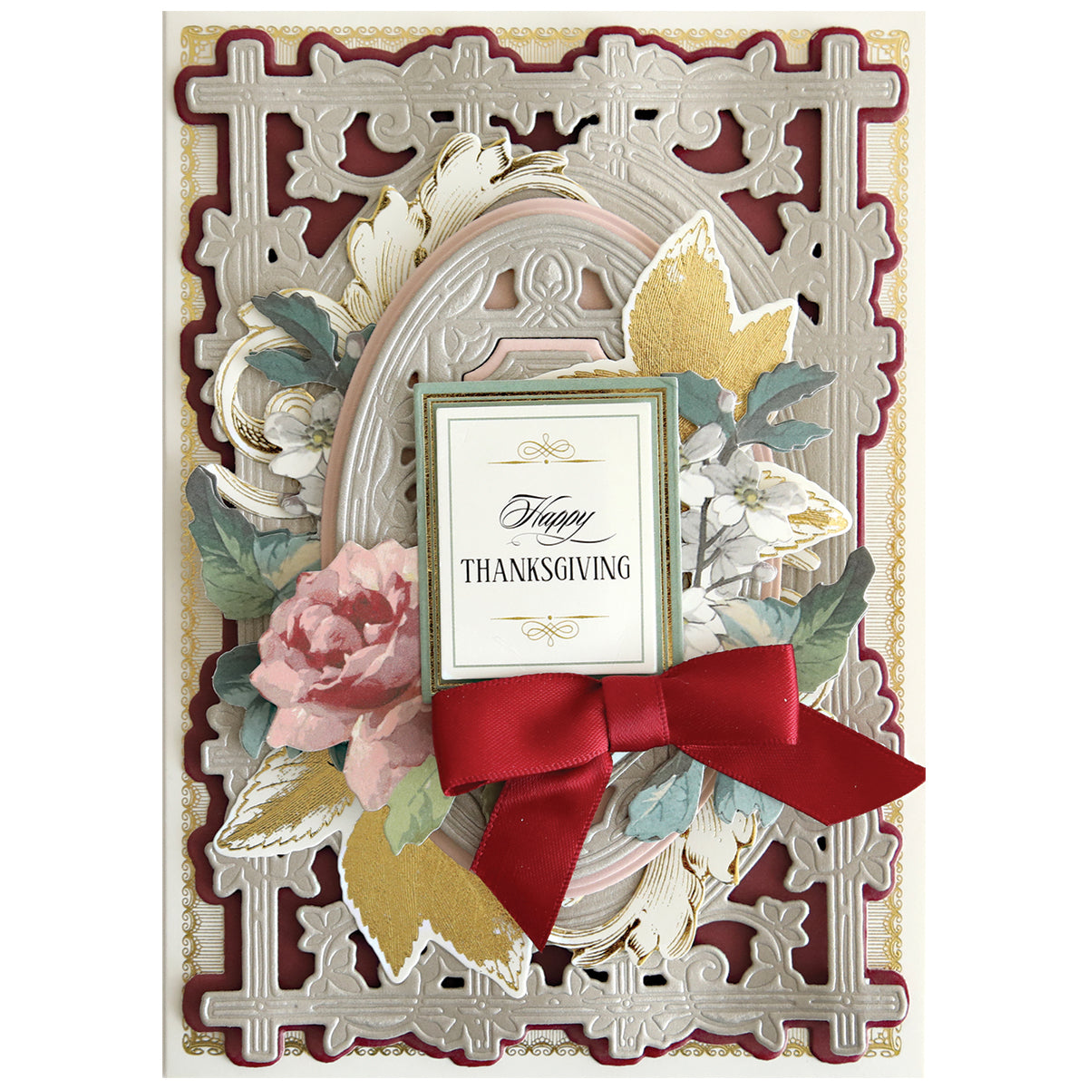 Decorative Thanksgiving card with layered gold and beige patterns, floral accents, a red bow, and an ornate "Happy Thanksgiving" sign—perfect for card making or handmade projects using Woodland 3D Concentric Frame Dies.