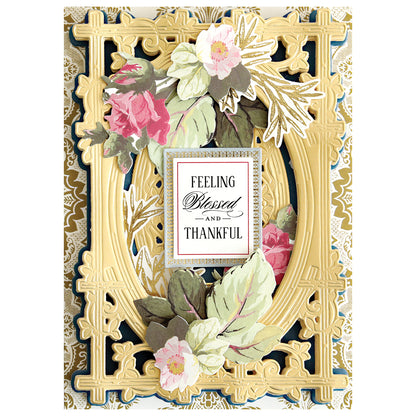 An ornate, gold-embossed card with pink and white flowers features "Feeling Blessed and Thankful"—ideal inspiration for handmade projects or card making using the Woodland 3D Concentric Frame Dies.