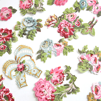 Phoebe Die Cut Embellishments feature colorful, vintage-style floral paper cutouts scattered on a white background, ideal for use as stickers or scrapbook decorations.