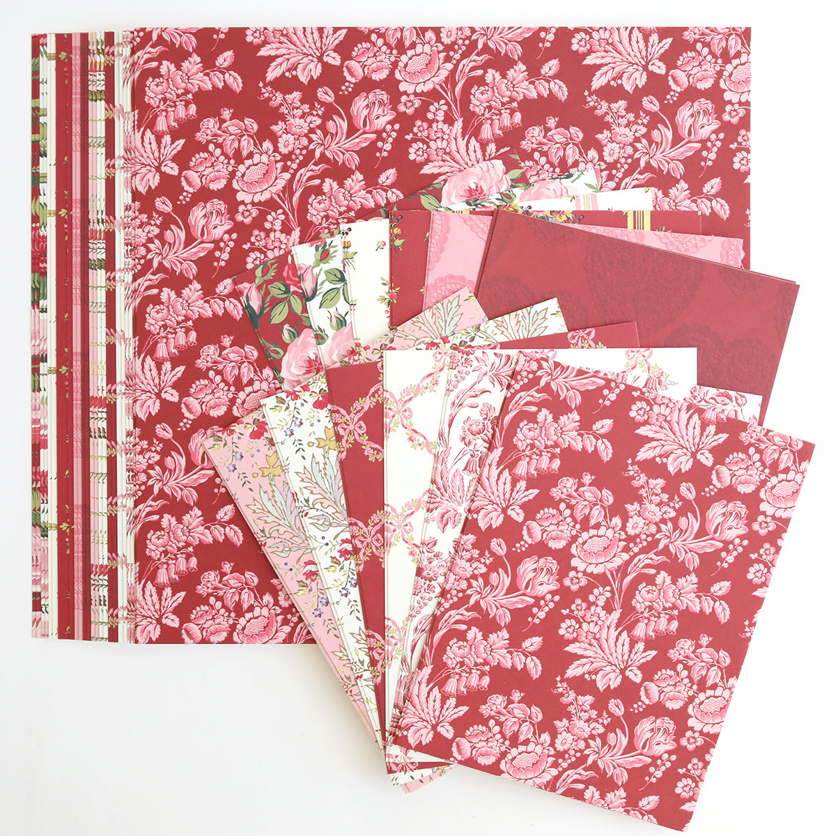 Heartfelt Cardstock is a fanned collection of patterned red, pink, and white floral scrapbook paper and double-sided cardstock with elegant stripes and decorative prints.