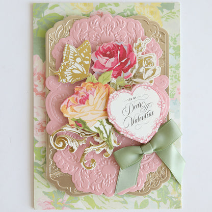 The Heartfelt Stickers set includes layered pink and gold designs, romantic florals, butterflies, green ribbon bows, vintage accents, and a heart-shaped "For My Valentine" tag—perfect for decorating Valentine's Day cards.