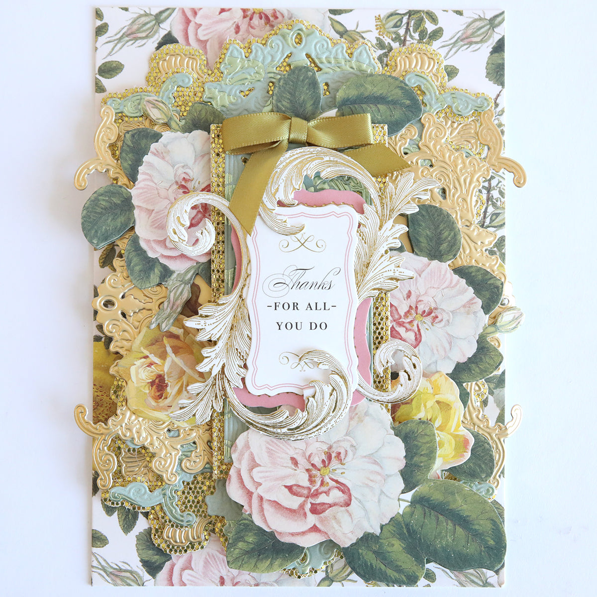 Floral greeting card made from Diamond Glitter 12x12 Cardstock, accented with gold detailing, a green ribbon, and “Thanks for all you do.” Ideal for scrapbooks. Includes 12 sheets.
