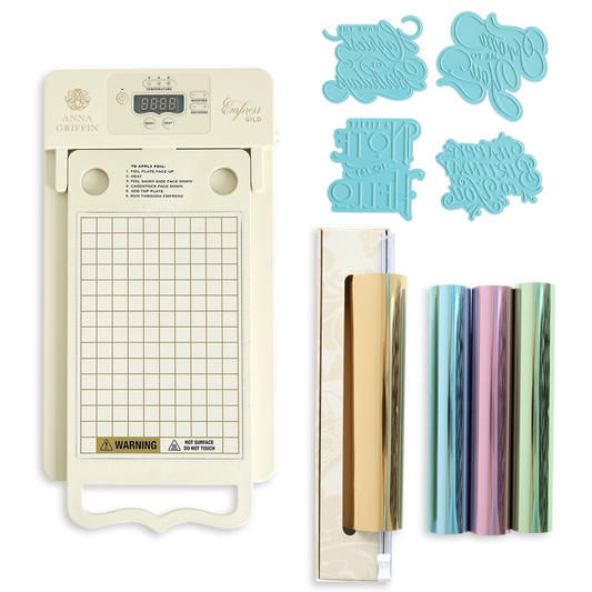 The Empress Gild Hot Foil Starter Bundle includes a digital display, four blue metal dies, and four metallic foil rolls in gold, silver, pink, and green—ideal for any heat-activated foiling system.
