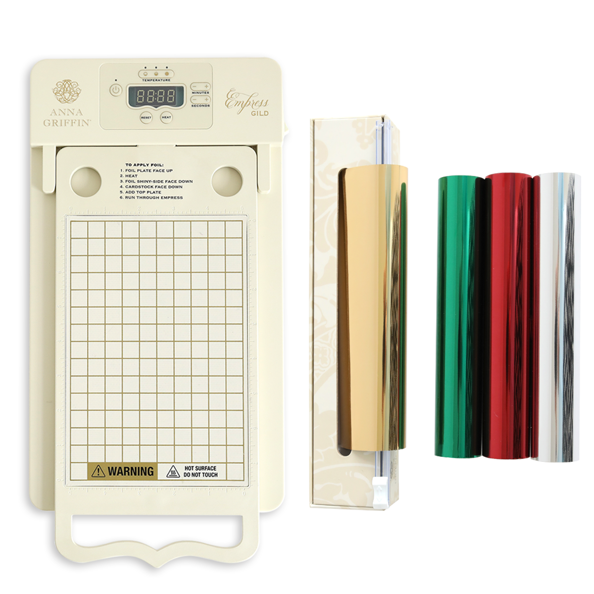 The Empress Gild hot Foil Machine with Holiday Hot Foil, featuring a digital display, grid platform, roll holder, and three foil rolls in gold, red, and green, is displayed on a white background.