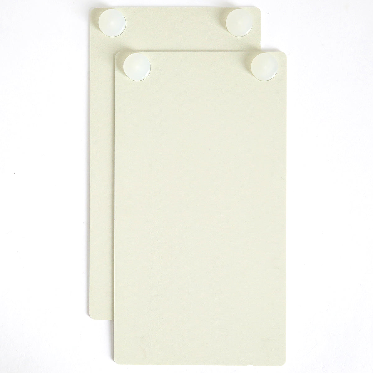 Two off-white rectangular panels with rounded corners and white circular fasteners are stacked on a white background—ideal for highlighting foil details made with your Empress Gild Hot Foil Starter Bundle.