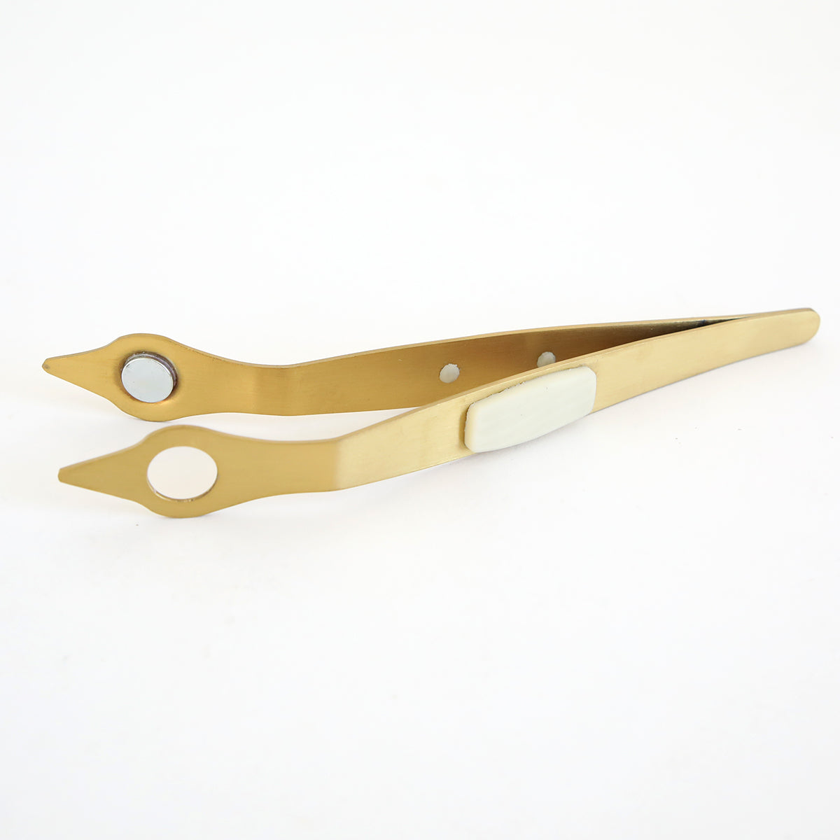 Gold-colored metal tweezers with circular openings near the tips and a white grip, designed for use with the Empress Gild Hot Foil Machine, are shown against a plain white background.