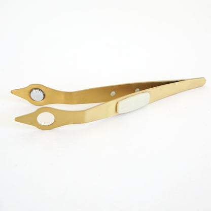 Gold-colored tweezers with pointed tips, circular holes, and a white grip—a precision tool for foil work or pairing with your Empress Gild Hot Foil Starter Bundle. Shown on a plain white background.