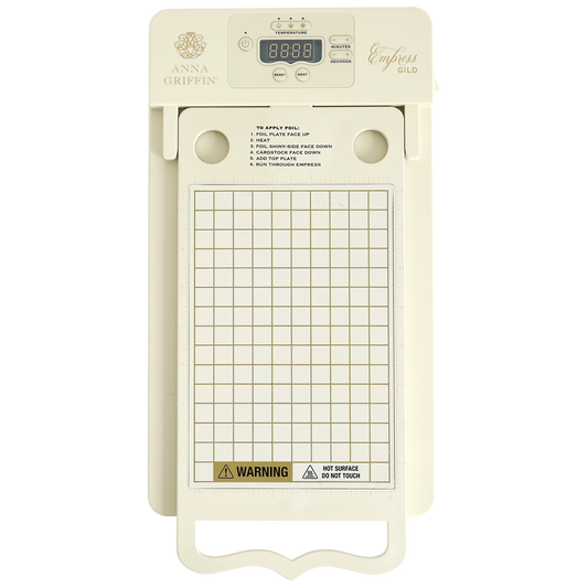 A cream-colored electronic die cutting machine with a digital display and "Anna Griffin Empress" branding, designed to work seamlessly with the Coming Soon! Empress Gild Hot Foil Machine for stunning metallic foil effects.