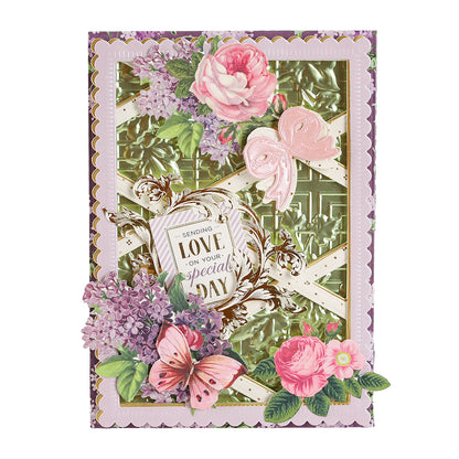A handmade greeting card created with Garden Gate and Pavilion 3D Embossing Folders, featuring a 3D embossed green background, pink floral accents, a pink bow, a butterfly, and a central “Sending love on your special day” tag.