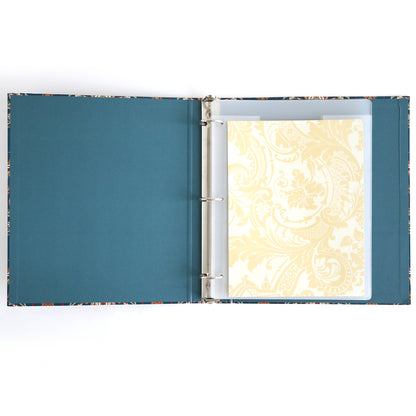 The Jasmine Die Storage Binder features blue inner covers and displays a decorative cream sheet in a plastic sleeve, making it ideal for craft organization or as a magnetic die storage binder for cutting dies.