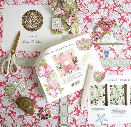 A flat lay of scrapbook supplies and color photos on a pink floral-patterned surface, featuring papers, flower cutouts, tools, the Create Spring 2026 Printed Instructions, and a "Class 3" certificate.